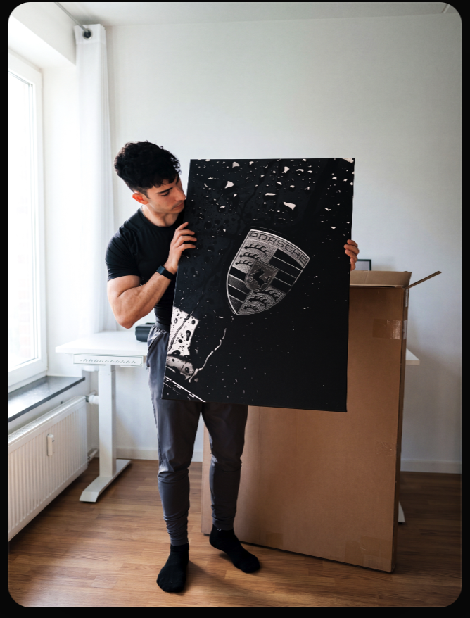 Daniel holding a Black Sheep canvas